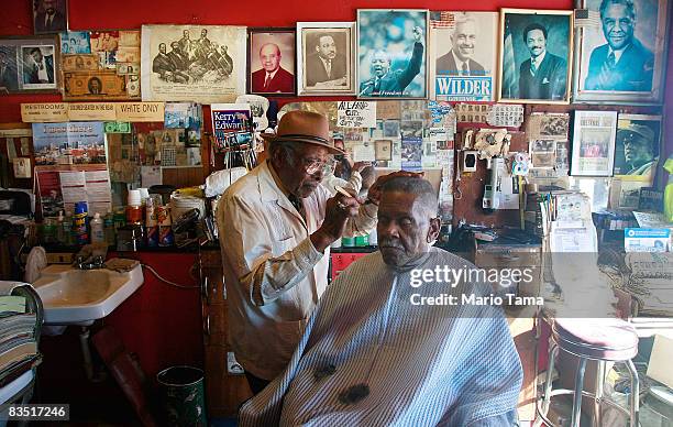 Civil Rights leader James Armstrong cuts Spencer Hill's hair in his barber shop where he also cut Dr. Martin Luther King Jr.'s hair October 31, 2008...