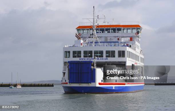 The new W-class Wightlink ferry Wight Sky departs Lymington in the New Forest en-route to Yarmouth on the Isle of Wight as one of the old and much...