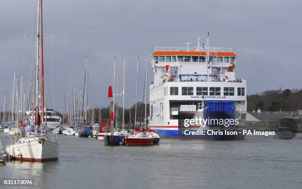 The new W-class Wightlink ferry Wight Sky departs Lymington in the New Forest en-route to Yarmouth on the Isle of Wight as one of the old and much...