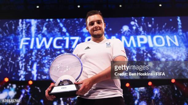 Spencer 'Gorilla' Ealing of England celebrates with the trophy after his victory in the final against Kai 'Deto' Wollin of Germany during day three...