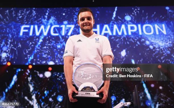 Spencer 'Gorilla' Ealing of England celebrates with the trophy after his victory in the final against Kai 'Deto' Wollin of Germany during day three...