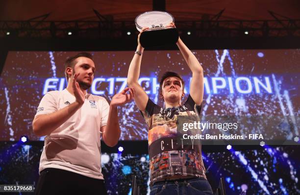 Spencer 'Gorilla' Ealing of England celebrates as Sean Allen lifts the trophy after Ealing's victory in the final against Kai 'Deto' Wollin of...