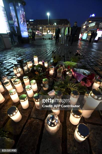 Flowers and candles have been left at the Turku Market Square in the Finnish city of Turku where several people were stabbed on August 18, 2017. Two...