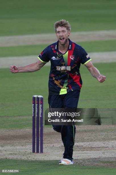 Calum Haggett of Kent Spitfires celebrates after taking the wicket of Surrey's Jason Roy during the NatWest T20 Blast South Group match between Kent...