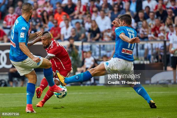 Nikola Maksimovic of Napoli and Christian Maggio of Napoli and Arturo Vidal of Bayern Muenchen battle for the ball during the Audi Cup 2017 match...