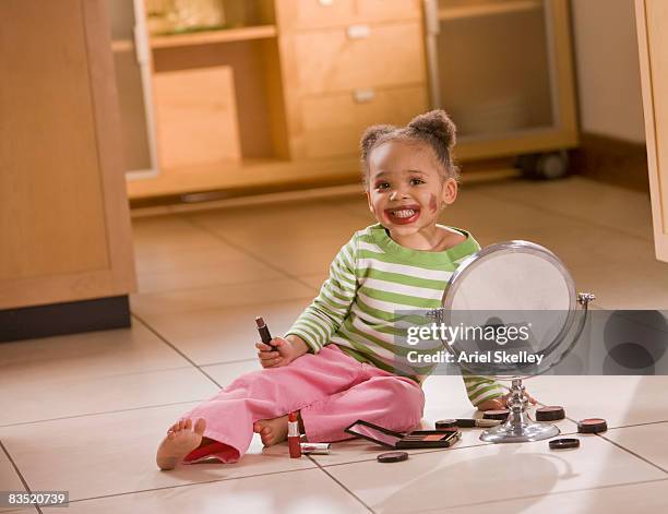 african girl playing with makeup - kids makeup stock pictures, royalty-free photos & images