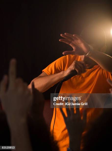 rapper holding microphone photos and premium high res... Rapper Holding Microphone Photos and Premium High Res Pictures - Getty ...