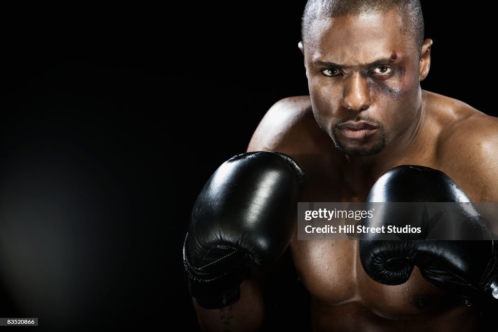 African boxer with bruised face