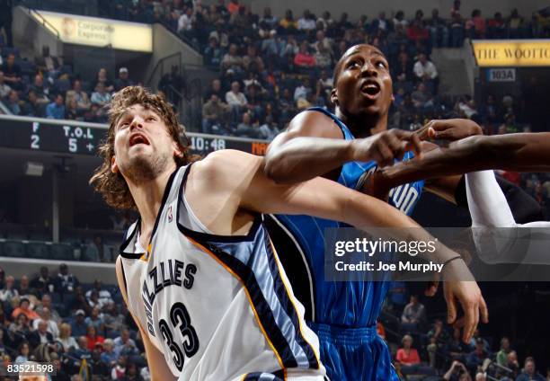 Marc Gasol of the Memphis Grizzlies and Dwight Howard of the Orlando Magic fight for a rebound on October 31, 2008 at the FedExForum in Memphis,...