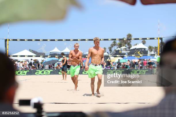 Chase Frishman and Avery Drost react to a point during their round 2 match at the AVP Manhattan Beach Open - Day 2 on August 18, 2017 in Manhattan...