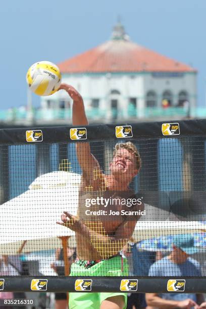 Chase Frishman sends the ball over the net during his round 2 match at the AVP Manhattan Beach Open - Day 2 on August 18, 2017 in Manhattan Beach,...