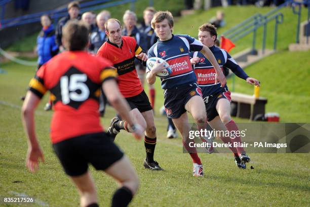 Dundee's Aubrey Horton runs through Stuart Melville's defence during the Scottish Hydro Electric Premiership Division Two at Mayfield Playing Fields,...