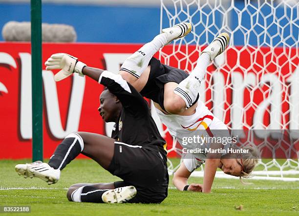 Alexandra Popp of Germany is up ended by Patricia Mantey of Ghana during the FIFA U-17 Women`s World Cup match between Germany and Ghana at QE II...