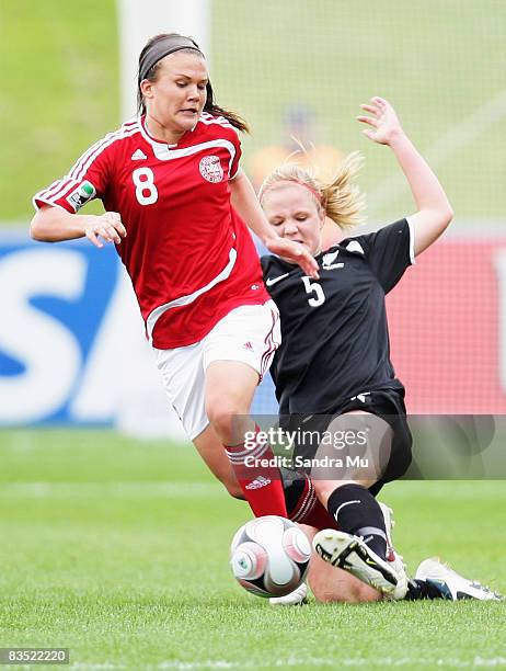 Briony Fisher of New Zealand reaches for the ball along side Katrine Veje of Denmark during the FIFA U-17 Women's World Cup match between New Zealand...