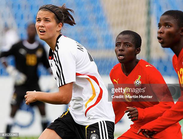 Dzsenifer Marozsan of Germany with Elizabeth Cudjoe of Ghana eye the ball during the FIFA U-17 Women`s World Cup match between Germany and Ghana at...