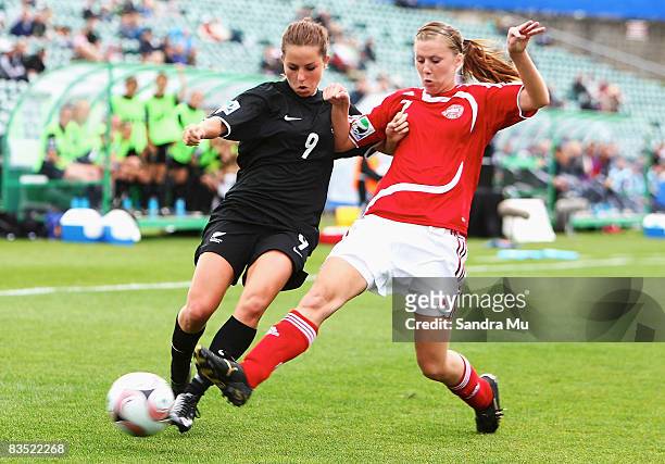 Hannah Wall of New Zealand and Sofie Junge of Denmark tackle for the ball during the FIFA U-17 Women's World Cup match between New Zealand and...