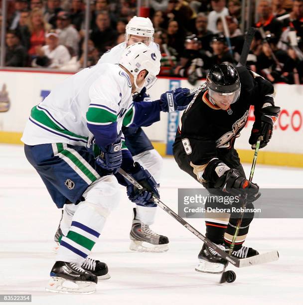 Mattias Ohlund of the Vancouver Canucks fights for the puck against Teemu Selanne of the Anaheim Ducks during the game on October 31, 2008 at Honda...