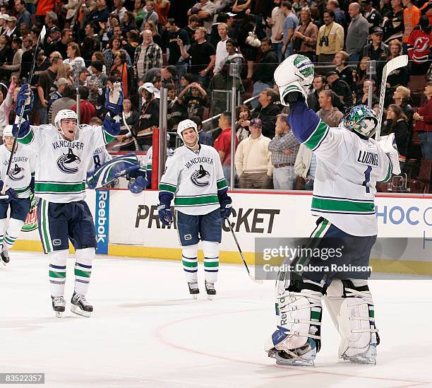 The Vancouver Canucks celebrate a 7-6 win in a shootout against the Anaheim Ducks during the game on October 31, 2008 at Honda Center in Anaheim,...