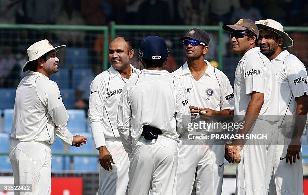 Indian cricket captain Anil Kumble , and teammates Sachin Tendulkar , Virendra Sehwag , Gautam Gambhir , Rahul Dravid and Zaheer Khan celebrate the...