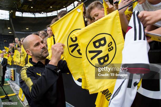 Head coach Peter Bosz of Dortmund gives autographs during the Borussia Dortmund Season Opening 2017/18 at Signal Iduna Park on August 4, 2017 in...