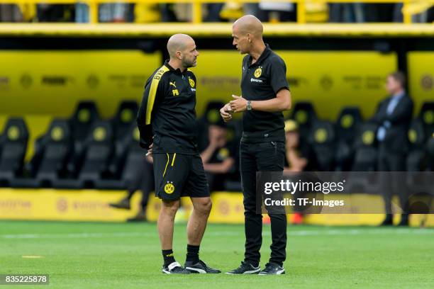 Head coach Peter Bosz of Dortmund speak with Carsten Cramer of Dortmund during the Borussia Dortmund Season Opening 2017/18 at Signal Iduna Park on...