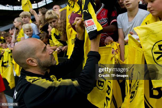 Head coach Peter Bosz of Dortmund gives autographs during the Borussia Dortmund Season Opening 2017/18 at Signal Iduna Park on August 4, 2017 in...