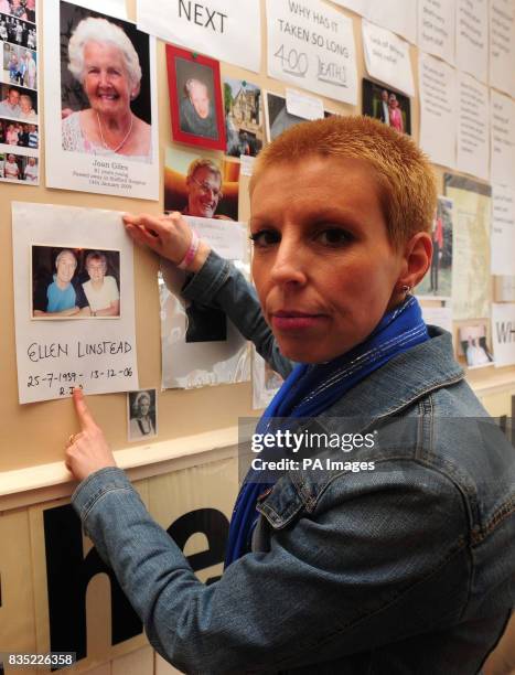 Deb Hazeldine whose mother Ellen Linstead died after catching Clostridium difficile and MRSA at Stafford Hospital, stands in front of a tribute wall...