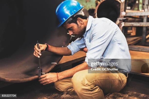 engineer making a final inspection to ensure the pipe is ready for assembly - vernier calliper stock pictures, royalty-free photos & images