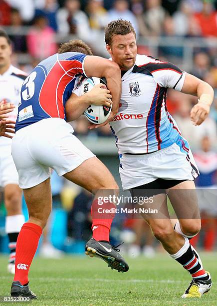 Ashton Sims of Fiji is tackled during the 2008 Rugby League World Cup Pool 2 match between Fiji and France at WIN Stadium on November 1, 2008 in...