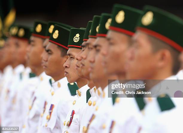 Soldiers wait to greet The Royal plane as HRH Camilla, Duchess of Cornwall and Prince Charles, Prince of Wales arrive at Brunei International Airport...