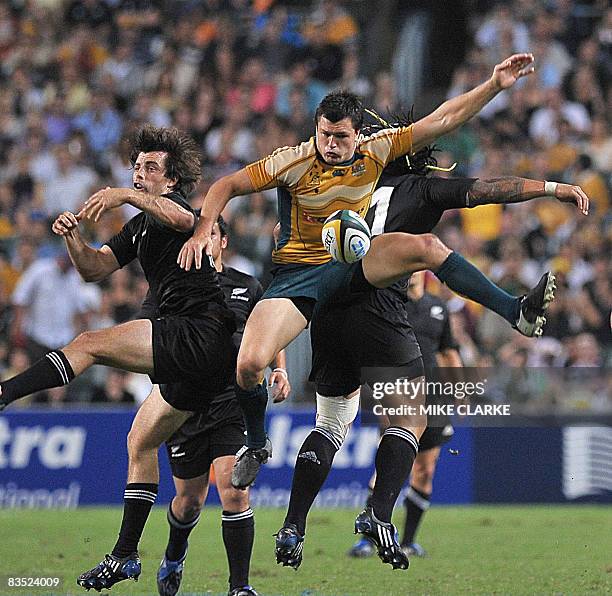 Adam Ashley-Cooper of Australia competes for the ball with New Zealand's Conrad Smith during their Bledisloe Cup rugby union match at Hong Kong...