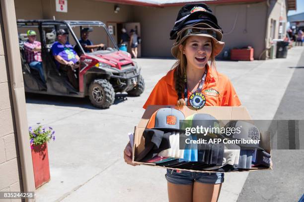 Avery Oppenlander sells eclipse souvenir products as eclipse enthusiasts gather in Madras, Oregon, on August 18, 2017. The rural central and eastern...