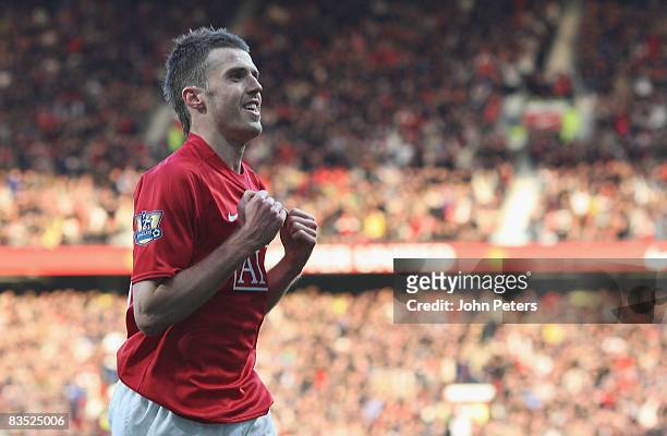 Michael Carrick of Manchester United celebrates scoring their second goal during the Barclays Premier League match between Manchester United and Hull...