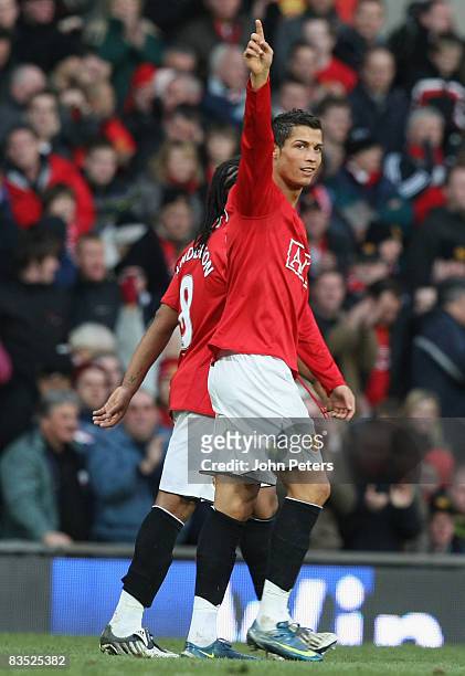 Cristiano Ronaldo of Manchester United celebrates scoring their third goal during the Barclays Premier League match between Manchester United and...
