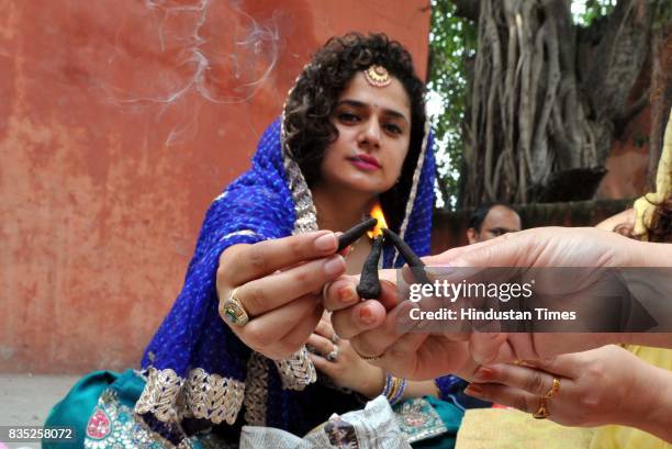 Women belonging to the Dogra community praying for the long life of their sons during the "Bacch Dua" festival, on August 18, 2017 in Jammu, India.