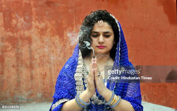 Women belonging to the Dogra community praying for the long life of their sons during the "Bacch Dua" festival, on August 18, 2017 in Jammu, India.