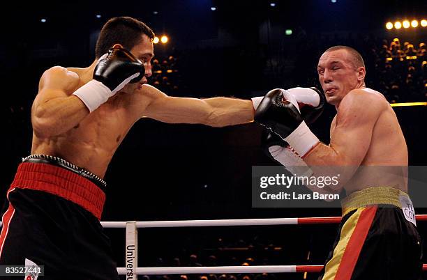 Felix Sturm of Germany punches Sebastian Sylvester of Germany during the WBA middleweight world championship fight at the Koenig Pilsener Arena on...