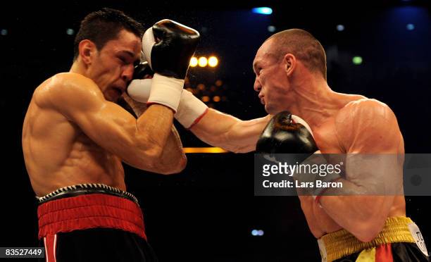 Sebastian Sylvester of Germany punches Felix Sturm of Germany during the WBA middleweight world championship fight at the Koenig Pilsener Arena on...