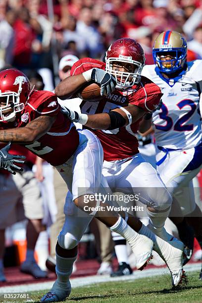 Williams of the Arkansas Razorbacks runs with the ball after making a catch against the Tulsa Golden Hurricanes at Donald W. Reynolds Stadium on...