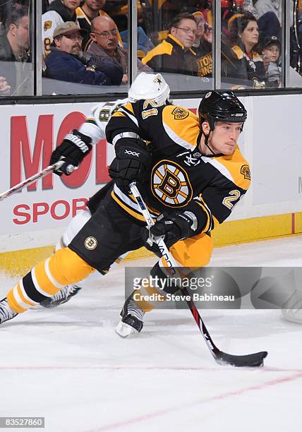 Andrew Ference of the Boston Bruins skates with the puck against the Dallas Stars at the TD Banknorth Garden on November 1, 2008 in Boston,...