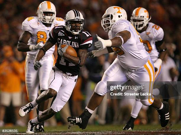 Kenny McKinley of the South Carolina Gamecocks runs away from the Tennessee Volunteers defense during their game at Williams-Brice Stadium on...
