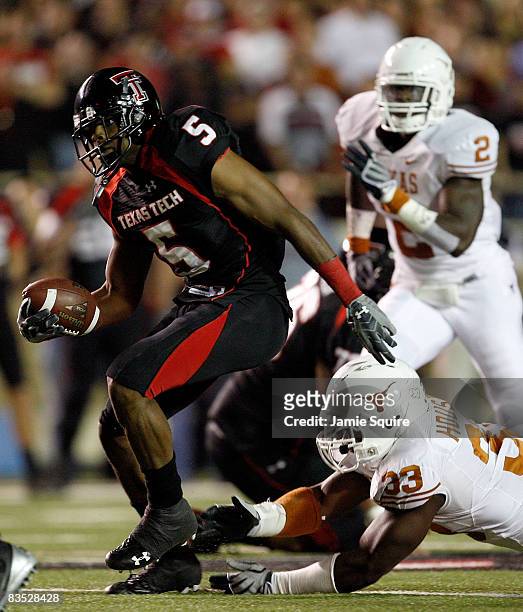 Michael Crabtree of the Texas Tech Red Raiders carries the ball after making a reception during the first half of the game against the Texas...