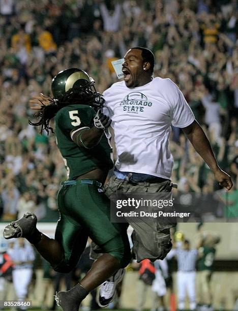 Gartrell Johnson of the Colorado State Rams celebrates his fourth quarter touchdown against the Brigham Young Cougars and received a penalty for...