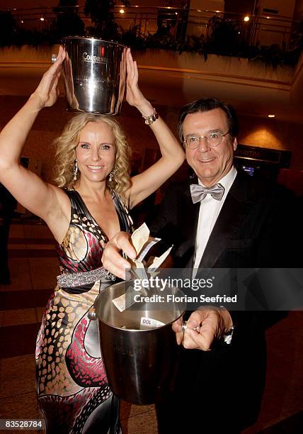 Presenter Katja Burkart and husband Hans Mahr selling lots during the Unesco Benefit Gala For Children 2008 at Hotel Maritim on November 01, 2008 in...