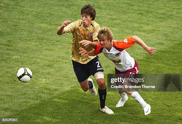 Luke Brattan of the Roar competes with Joel Witherdin of the Jets during the round six National Youth League match between the Newcastle Jets and the...