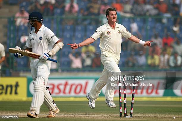 Brett Lee of Australia celebrates bowling Rahul Dravid during day five of the Third Test match between India and Australia at the Feroz Shah Kotla...