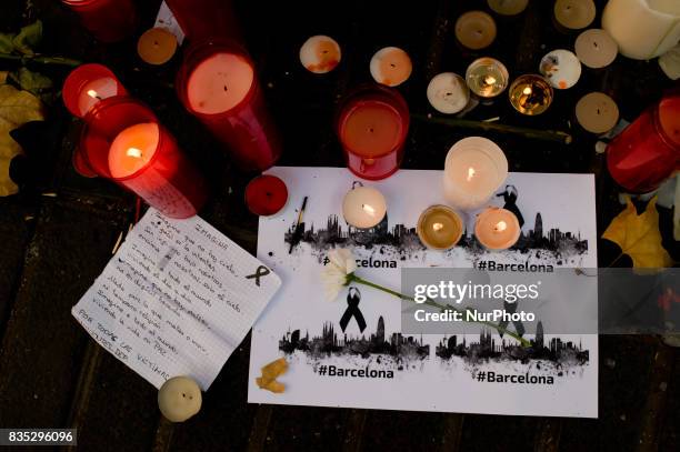 Candles stand in Las Ramblas of Barcelona, Spain, on 18 August 2017, to pay tribute to the victims a day after a van ploughed into the crowd, killing...