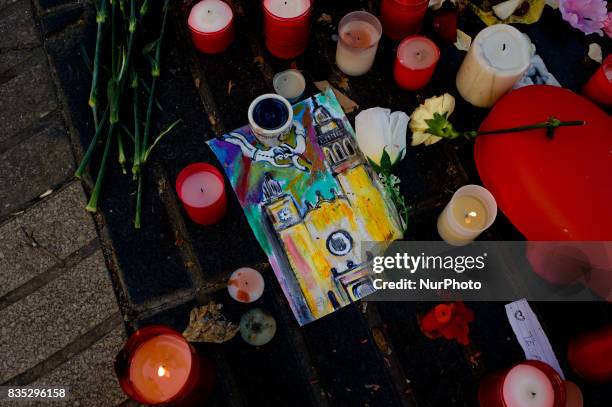 Flowers and candles stand in Las Ramblas of Barcelona, Spain, on 18 August 2017, to pay tribute to the victims a day after a van ploughed into the...