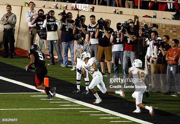 Michael Crabtree of the Texas Tech Red Raiders carries the ball into the end zone to score the winning touchdown during the game against the Texas...