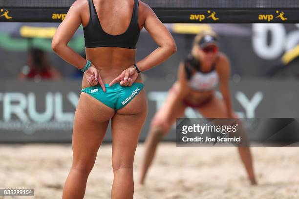 Jace Pardon sends a signal to her partner as April Ross prepares to receive the serve during their round 2 match at the AVP Manhattan Beach Open -...